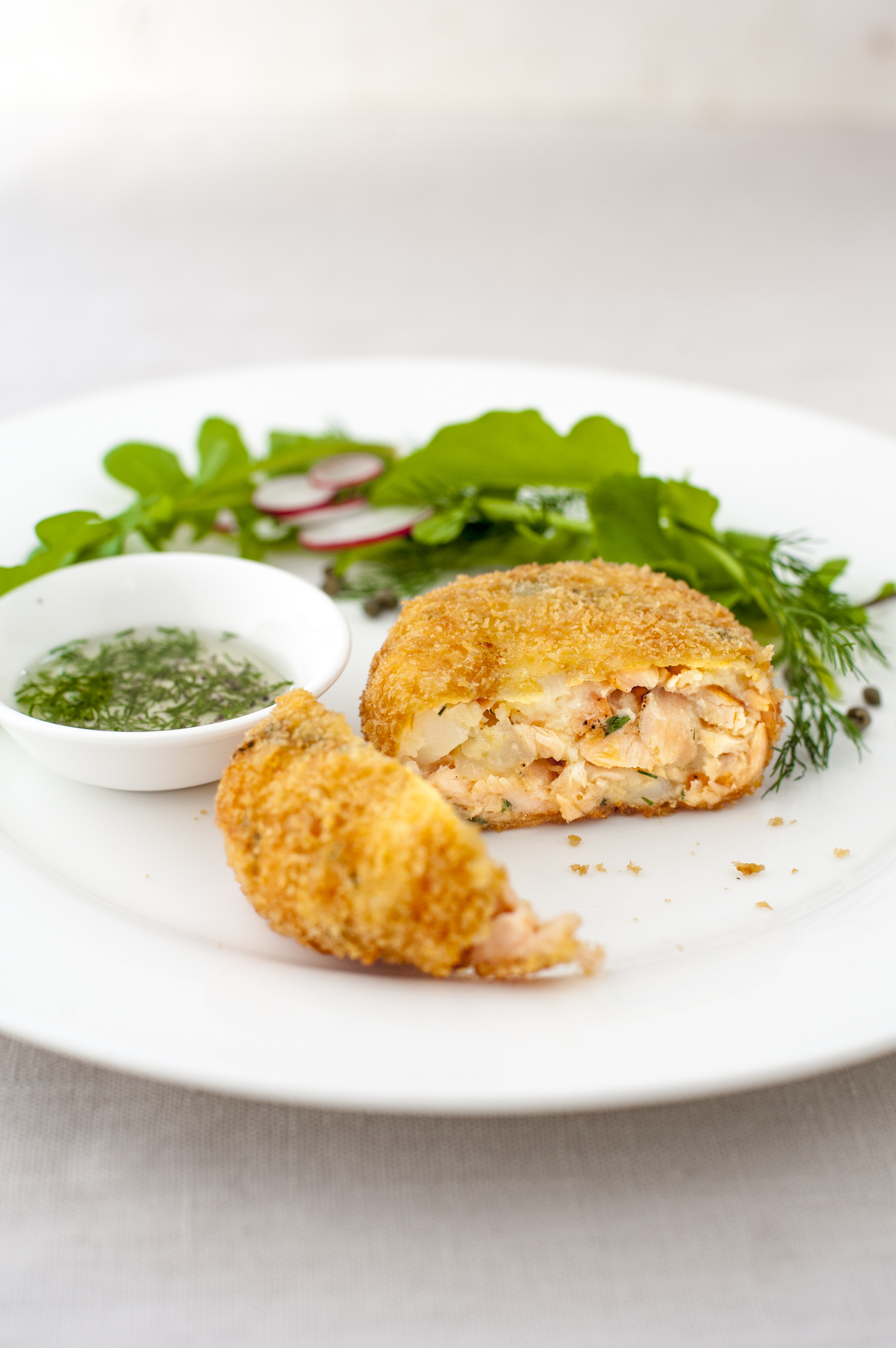 Huon Salmon fish cakes with rocket, radish, capers and lime